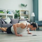 a man is doing push ups on the floor
