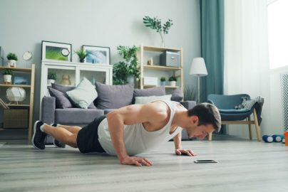 a man is doing push ups on the floor